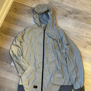 Men’s gray windbreaker.